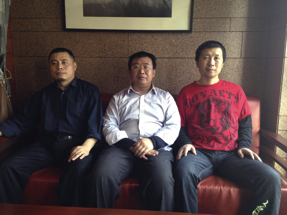 In this Monday, April 7, 2014 photo released by Xiang Li, Chinese rights lawyers, from left, Wang Cheng, Jiang Tianyong and Tang Jitian sit on a sofa at a restaurant in Beijing. Wang, Jiang and Tang are among a group of four Chinese rights lawyers who allege they were tortured by police after being rounded up in late March outside a detention center in a farming community on the northeastern edge of China. They had joined several people in shouting to demand information about relatives believed locked up inside because they were members of Falun Gong - banned as a cult though they claim to be a peaceful spiritual movement. (AP Photo/Xiang Li)