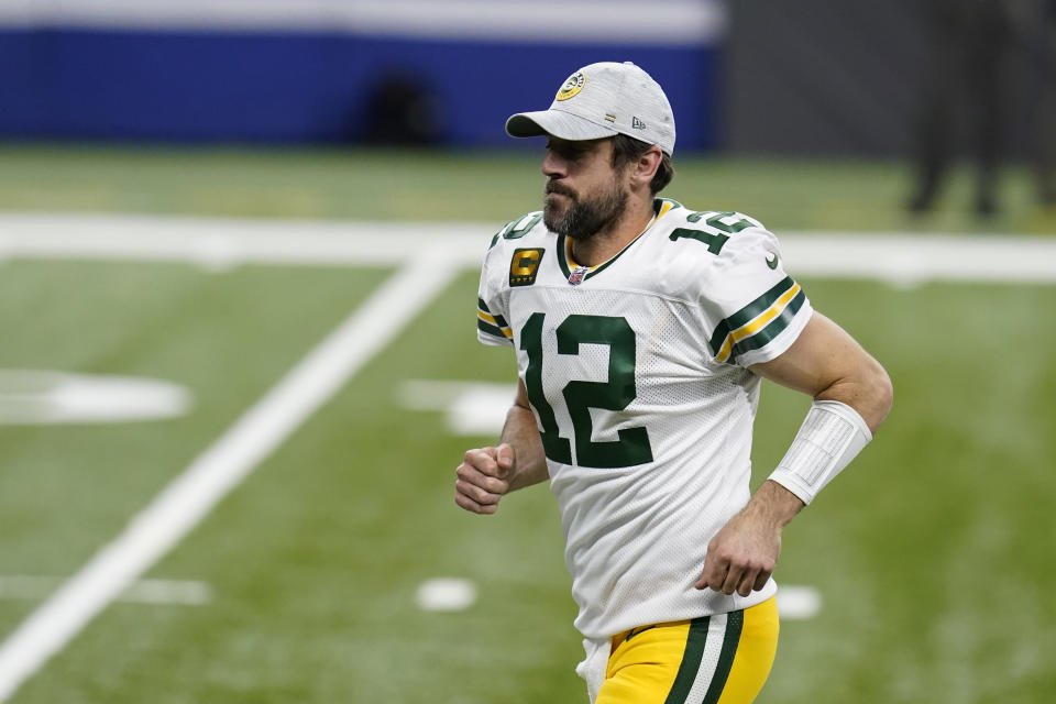 Green Bay Packers quarterback Aaron Rodgers runs off the field follow an NFL football game against the Indianapolis Colts, Sunday, Nov. 22, 2020, in Indianapolis. Indianapolis won in overtime. (AP Photo/Michael Conroy)