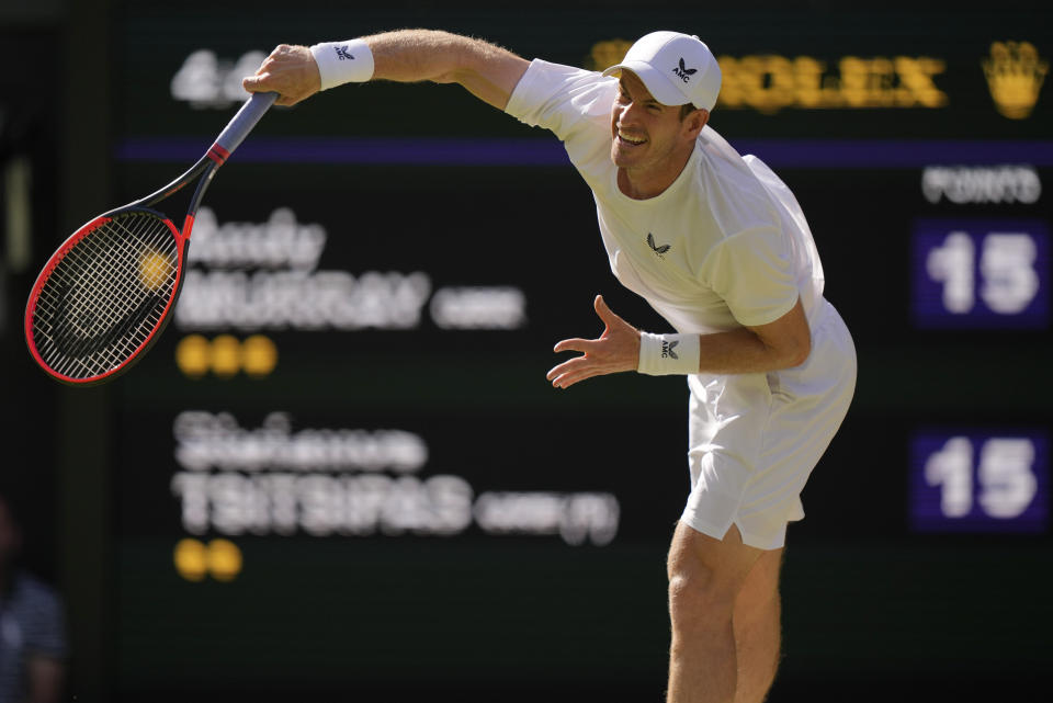 Britain's Andy Murray serves to Stefanos Tsitsipas of Greece in a men's singles match on day five of the Wimbledon tennis championships in London, Friday, July 7, 2023. (AP Photo/Alberto Pezzali)