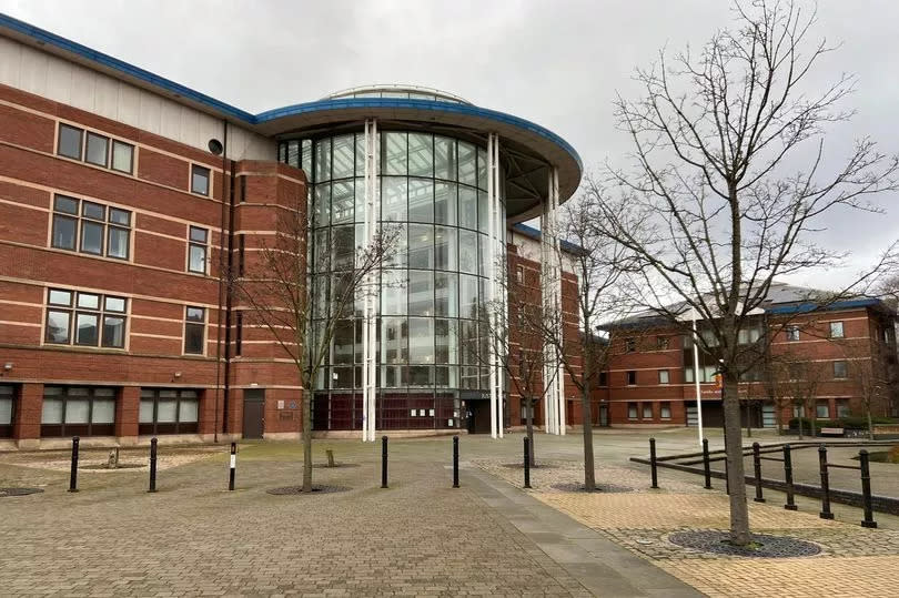 General exterior view of Nottingham Magistrates Court with grey sky