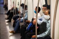 Commuters sit in a carriage of a Yellow Line train after Delhi Metro Rail Corporation (DMRC) resumed services in New Delhi on September 7, 2020.(Photo by PRAKASH SINGH/AFP via Getty Images)