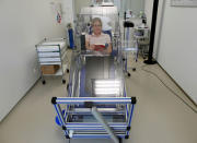 A test subject undergoes a whole body indirect calorimetry test in the Nestle metabolic unit in Lausanne, Switzerland, June 6, 2012. REUTERS/Ruben Sprich/File Photo