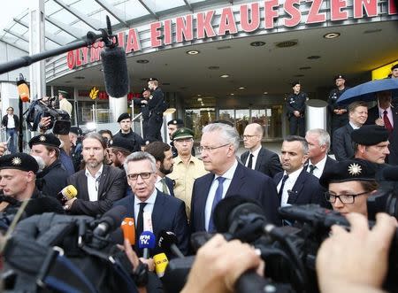 German Interior Minister Thomas De Maiziere makes a statement in front of the Olympia shopping mall, where yesterday's shooting rampage started, in Munich, Germany July 23, 2016. REUTERS/Arnd Wiegmann