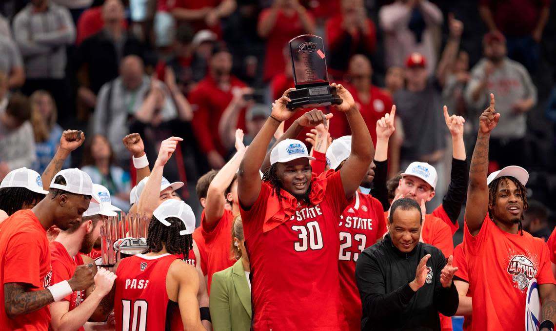 N.C. State’s D.J. Burns Jr. (30) hoists the ACC Tournament MVP trophy following his 20 point performance in the Wolfpack’s 84-76 victory over North Carolina at the ACC Men’s Basketball Tournament Championship at Capitol One Arena on Saturday, March 16, 2024 in Washington, D.C.