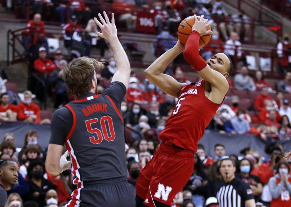 Nebraska guard Bryce McGowen, right, is defended by Ohio State center Joey Brunk during the first half of an NCAA college basketball game in Columbus, Ohio, Tuesday, March 1, 2022. (AP Photo/Paul Vernon)