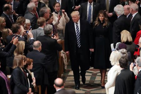 U.S. President Donald Trump and First Lady Melania Trump arrive to a church service at the National Cathedral in Washington, U.S., January 21, 2017. REUTERS/Carlos Barria
