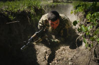 A newly recruited soldier of the 3rd assault brigade trains, in Kyiv, Ukraine, Friday, May 17, 2024. A divisive mobilisation law in Ukraine came into force on Saturday, as Kyiv struggles to boost troop numbers after Russia launched a new offensive. (AP Photo/Efrem Lukatsky)