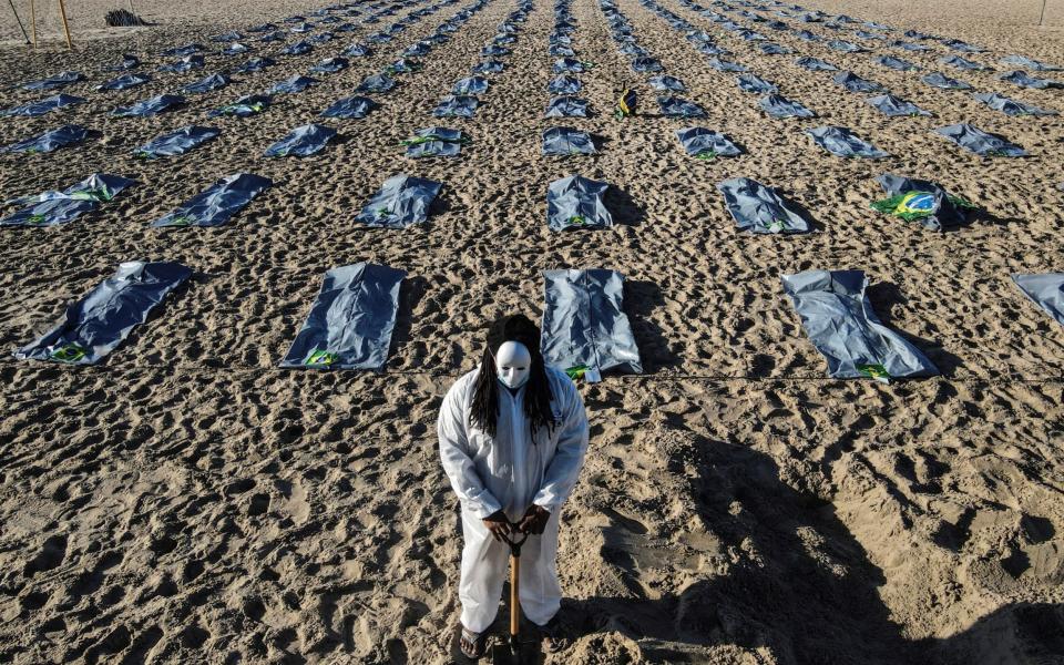 Activists in Rio de Janeiro laid out 400 fake body bags in a ceremony to mark the deaths of 400,000 Covid victims - Shutterstock