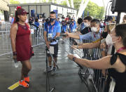 Naomi Osaka, of Japan, speaks with journalists after defeating China's Zheng Saisai during the tennis competition at the 2020 Summer Olympics, Sunday, July 25, 2021, in Tokyo, Japan. (AP Photo/Andrew Dampf)