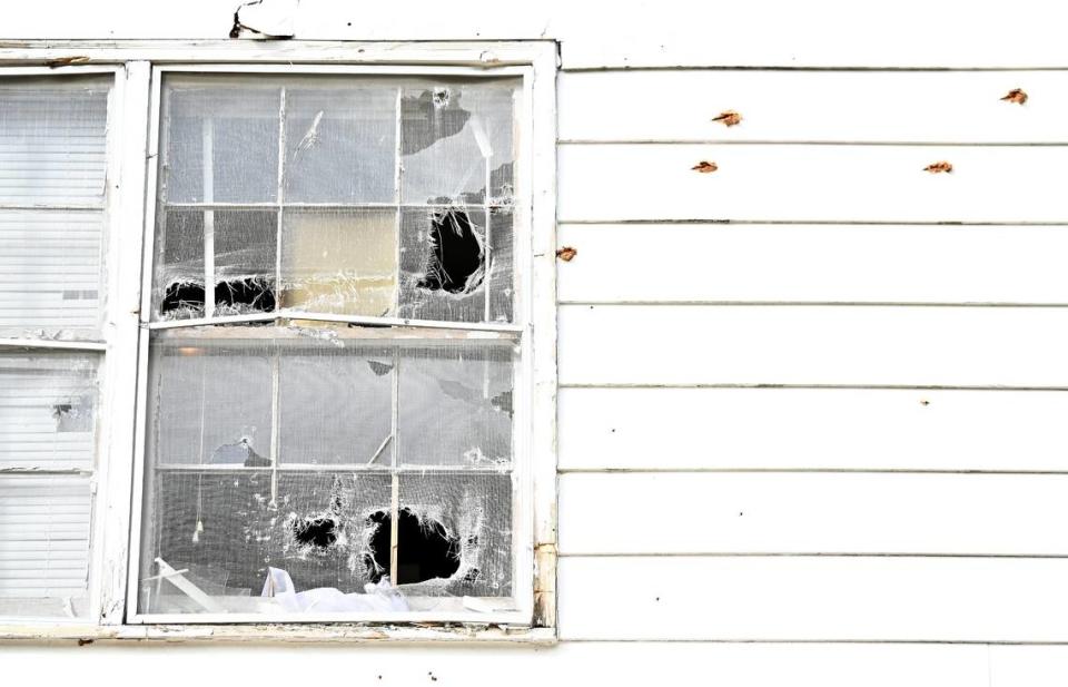 Bullet holes fill an upstairs window and paneling of the home located at 5525 Galway Drive where three members of the U.S. Marshals task force and a CMPD Officer Joshua Eyer were killed on Monday, April 29, 2024 when they were serving a warrant to the suspect. Four other officers were wounded during the shooting.