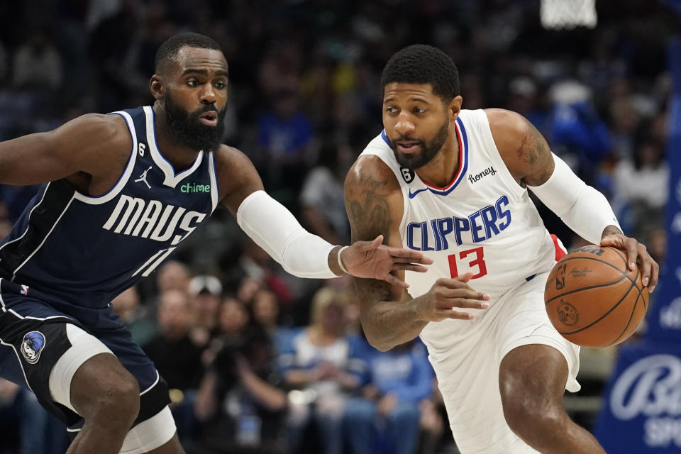 Los Angeles Clippers guard Paul George (13) drives against Dallas Mavericks forward Tim Hardaway Jr. (11) during the first quarter of an NBA basketball game in Dallas, Sunday, Jan. 22, 2023. (AP Photo/LM Otero)