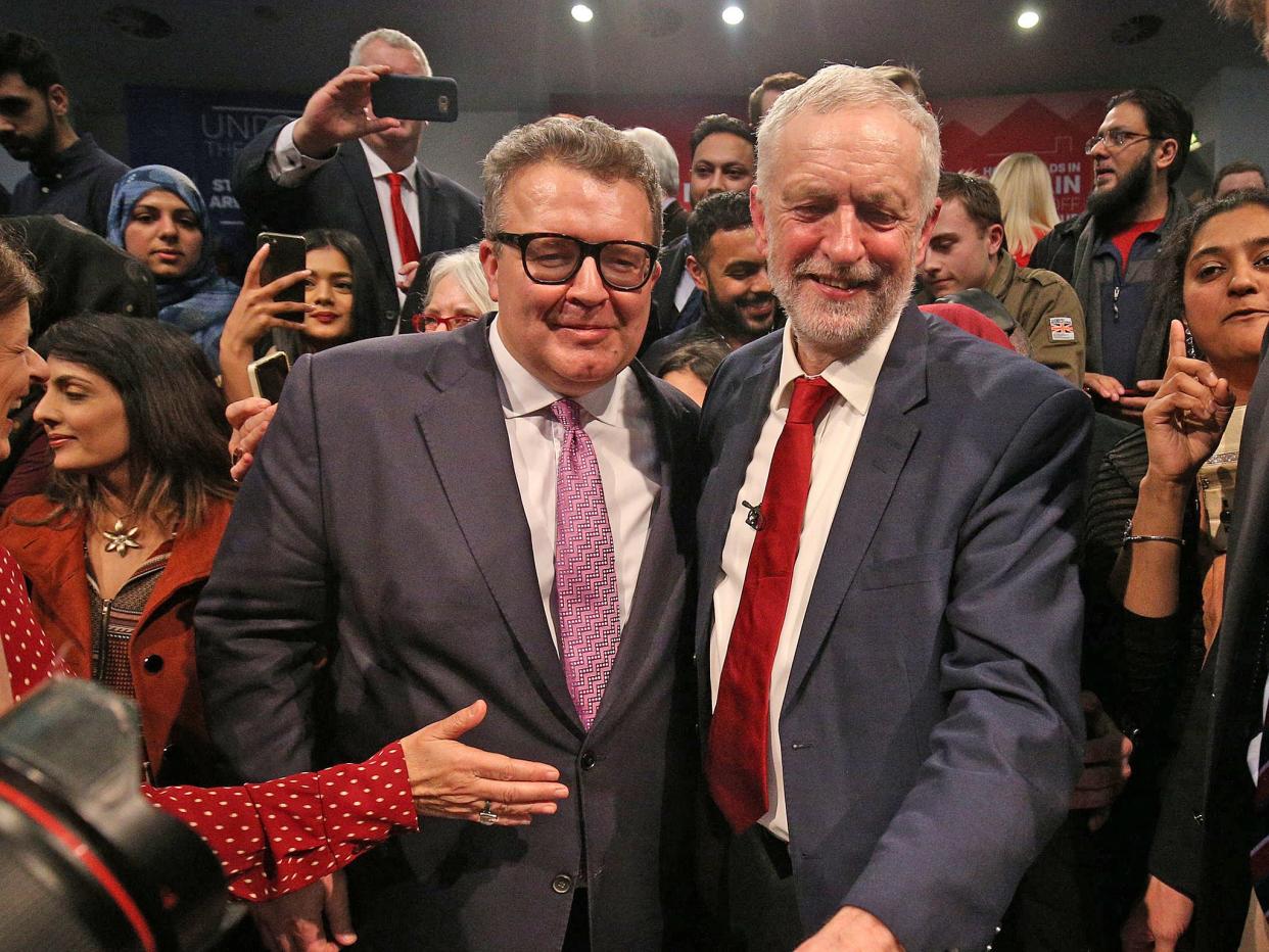 Labour party leader Jeremy Corbyn is congratulated by deputy leader Tom Watson after he addresses a post-Budget rally at the Bethel Convention Centre, West Bromwich, in 2017: Aaron Chown/PA Archive/PA Images