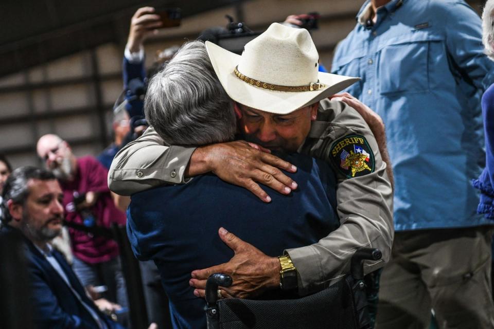 Uvalde County Sheriff Ruben Nolasco hugs Governor Greg Abbott in 2022. (AFP via Getty Images)