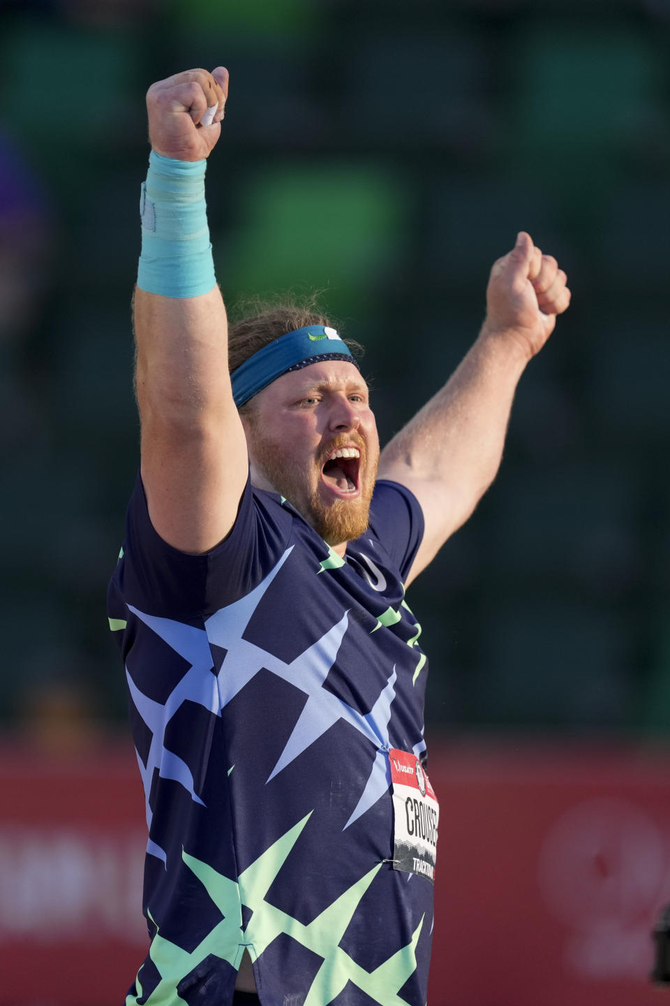 Ryan Crouser celebrates after setting a world record during the finals of men's shot put at the U.S. Olympic Track and Field Trials Friday, June 18, 2021, in Eugene, Ore. (AP Photo/Charlie Riedel)