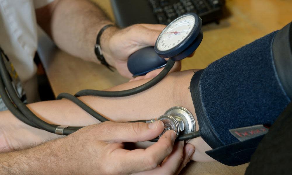 A doctor seeing a patient