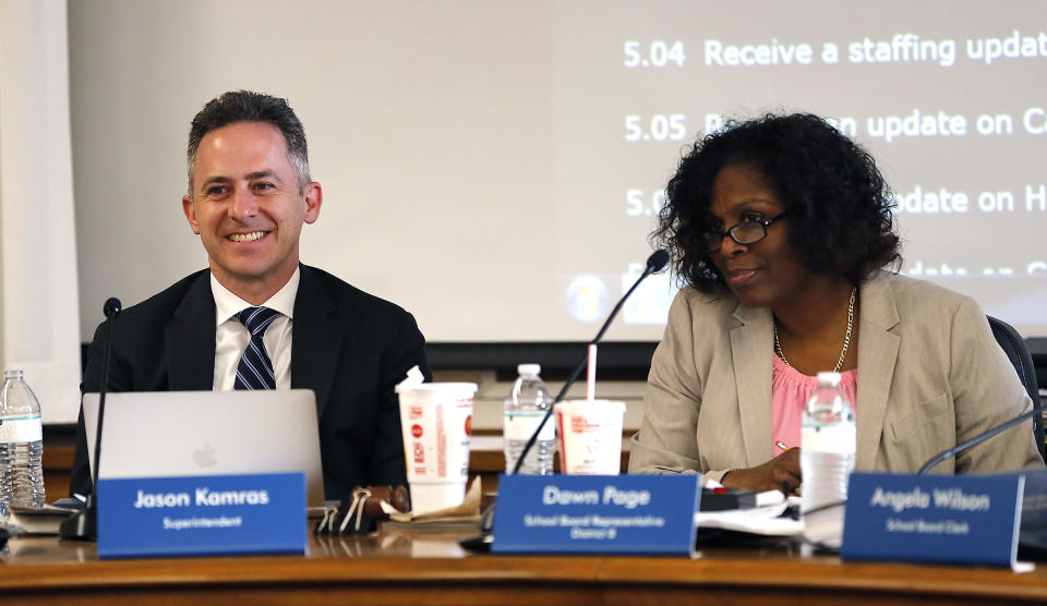FILE - Richmond City Schools Superintendent Jason Kamras, left and School Board Chair Dawn Page, right, listen during a Richmond School Board meeting on June 18, 2018, in Richmond, Va. Kamras tried to remake one of the most untouchable aspects of school — the academic calendar — to give kids more time with teachers. It’s the kind of drastic intervention some experts say is needed to help students recover after two-and-a-half years of interrupted schooling due to COVID-19. (Mark Gormus/Richmond Times-Dispatch via AP, File)