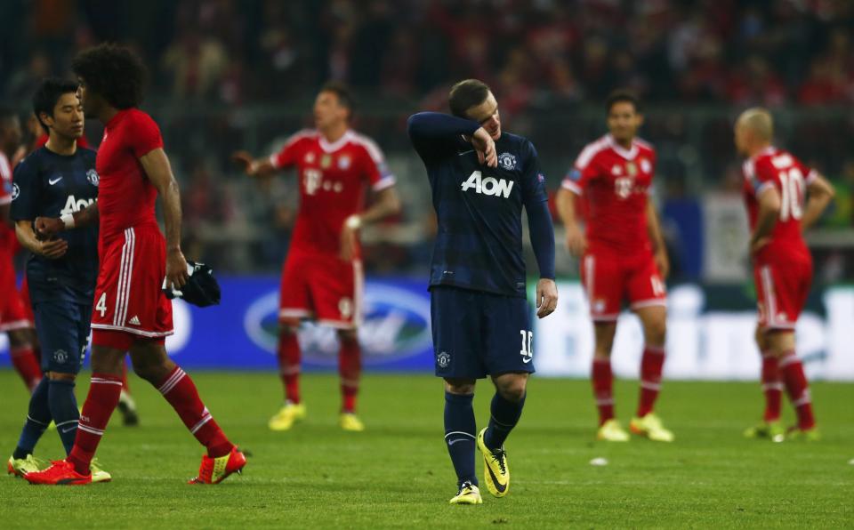 Manchester United's Rooney reacts after their Champions League quarter-final second leg soccer match against Bayern Munich in Munich