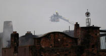 Firefighters attend to a blaze at the Mackintosh Building at the Glasgow School of Art, which is the second time in four years, Glasgow, Scotland, Britain June 16, 2018. REUTERS/Russell Cheyne