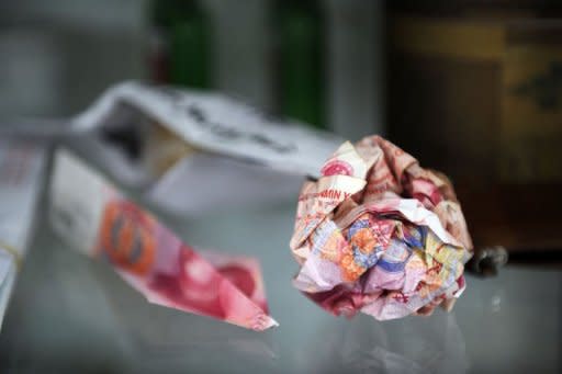 Yuan notes that were thrown over the wall of Chinese artist Ai Weiwei's home are displayed at his studio in Beijing on November 9, 2011. Total donations have now reached 6.25 million yuan, Liu Yanping, who works with Ai, told AFP, adding support for the artist showed no sign of abating