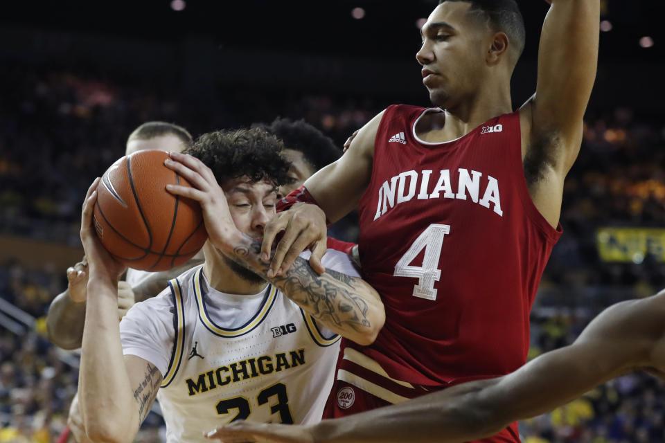 Michigan forward Brandon Johns Jr. (23) is defended by Indiana forward Trayce Jackson-Davis (4) during the second half of an NCAA college basketball game, Sunday, Feb. 16, 2020, in Ann Arbor, Mich. (AP Photo/Carlos Osorio)