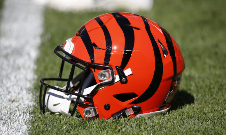 A Cincinnati Bengals helmet sitting on the field.