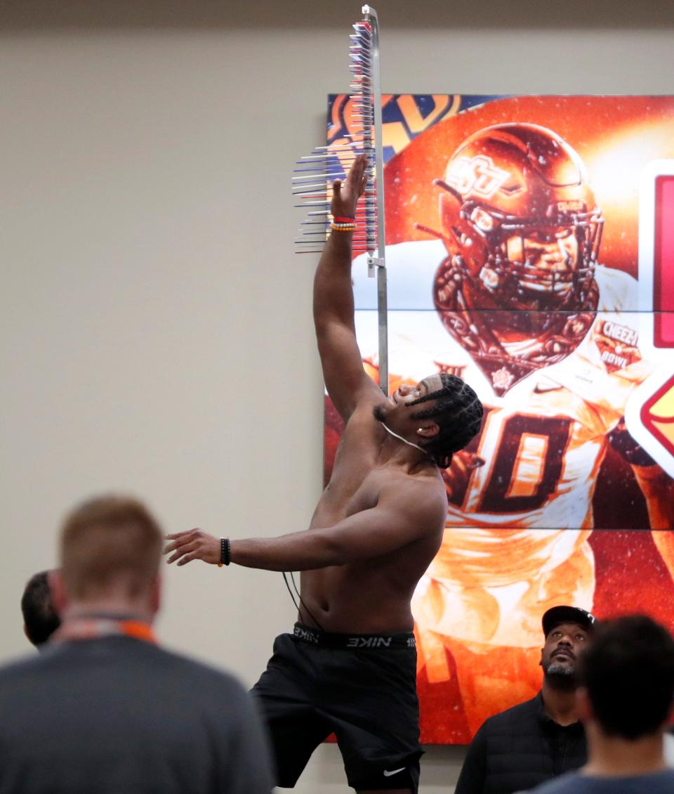 OSU linebacker Lamont Bishop shows off his leaping ability Wednesday during the Cowboys' Pro Day in Stillwater.