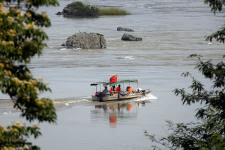 A Chinese boat with a team of geologists surveys the Mekong River, at the border between Laos and Thailand April 23, 2017. Picture taken April 23, 2017. REUTERS/Jorge Silva