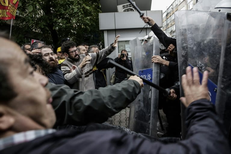 Protesters clash with Turkish riot police during a demonstration on October 13, 2015 in Istanbul against the deadly attacks in Ankara