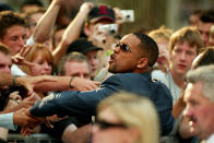 Actor Will Smith greets fans as he arrives at the UK premiere of his new movie, "I, Robot" in Leicester Square, London, Wednesday, August 4, 2004. (AP Photo/John D McHugh)