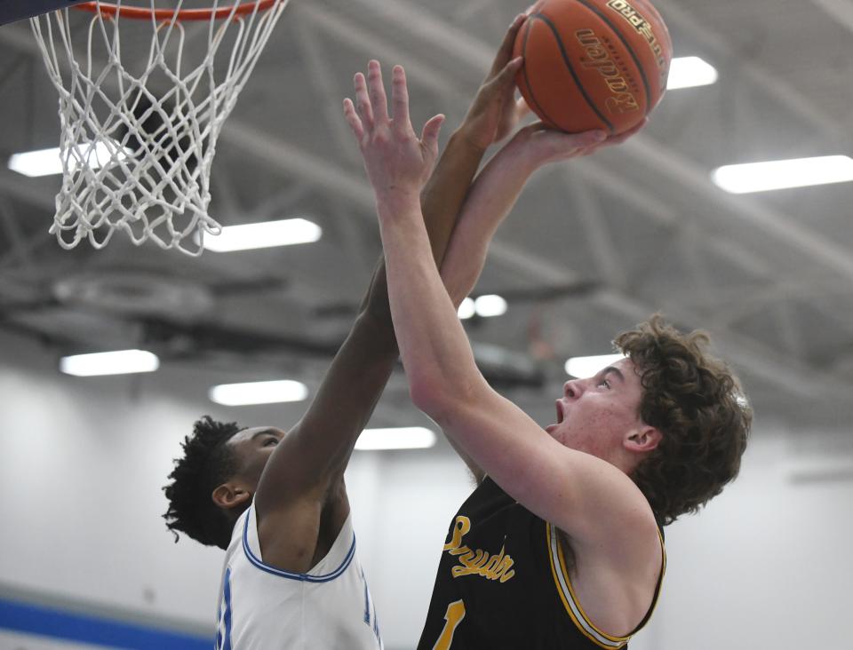 Estacado's Bobby Ross, left, blocks a shot by Snyder's Dyllan Angeley in a District 5-4A basketball game Tuesday, Feb. 7, 2023, at Estacado High School.