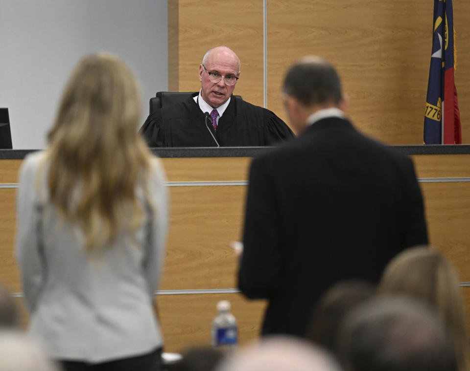 Superior Court Judge David Hall addresses Molly Corbett, left, as she pleads no contest to voluntary manslaughter during a hearing, Monday, Oct. 30, 2023, for Molly Corbett and her father, Thomas Martens, in the 2015 death of Molly's husband, Jason Corbett, at the Davidson County Courthouse in Lexington, N.C. (Walt Unks/The Winston-Salem Journal via AP, Pool)