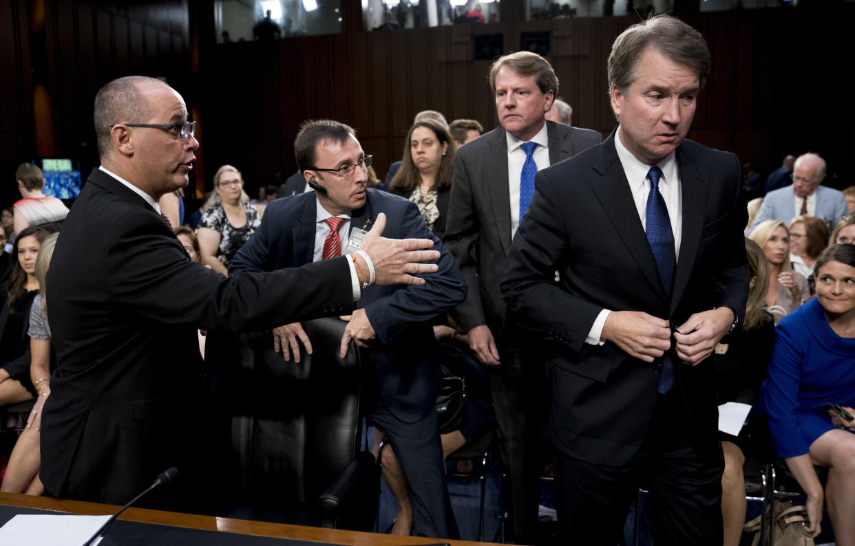 White House counsel Don McGahn (second from right) watches as Fred Guttenberg (left), the father of Jamie Guttenberg, attempts to shake hands with Brett Kavanaugh. (Photo: Andrew Harnik/Associated Press)