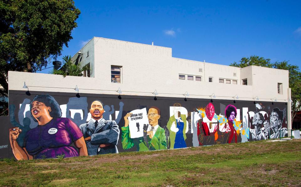 A mural on the Respectable Steet wall at 518 Clematis Street in downtown West Palm Beach shows the history of the civil rights movement utilizing portraits and quotes Friday, February 26, 2021. The mural is a collaboration between Street Art Revolution artists Dahlia Perryman, Eduardo Mendieta, Tracy Guiteau, and Nate Dee. The artists combined styles to create the mural using both spray paint and hand brushwork on the 100 feet wide x 18 feet tall wall. The mural was funded by the West Palm Beach DDA.