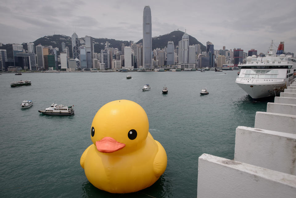 The 16.5-metre-tall inflatable Rubber Duck art installation is seen at the Victoria Harbour in Hong Kong on May 2, 2013. The inflatable duck by Dutch artist Florentijn Hofman will be on display in the former British colony until June 9.  AFP PHOTO / Philippe Lopez        (Photo credit should read PHILIPPE LOPEZ/AFP via Getty Images)