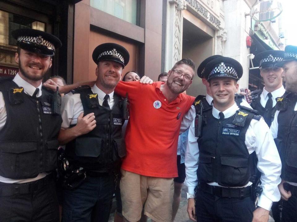 Tom Berwick, pictured with police officers at last year's Pride march.