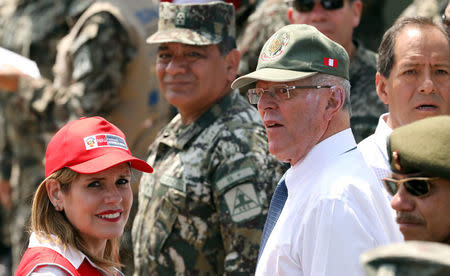 Peru's President Pedro Pablo Kuczynski and Prime Minister and Second Vice-President Mercedes Araoz participate in a military event at Rimac army headquarters in Lima, Peru March 20, 2018. Picture taken March 20, 2018. REUTERS/Mariana Bazo