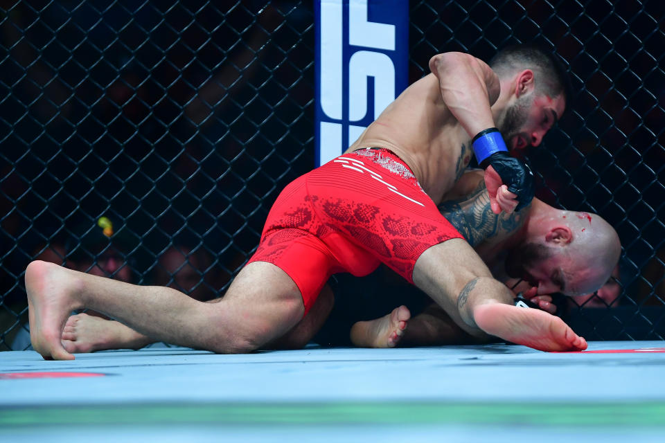 Feb 17, 2024; Anaheim, California, USA; Ilia Topuria lands hits against Alexander Volkanovski for his KO victory during UFC 298 at Honda Center. Mandatory Credit: Gary A. Vasquez-USA TODAY Sports