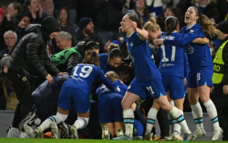 Chelsea players celebrate their penalty shootout win over Lyon in the Women's Champions League - JUSTIN TALLIS/AFP VIA GETTY IMAGES