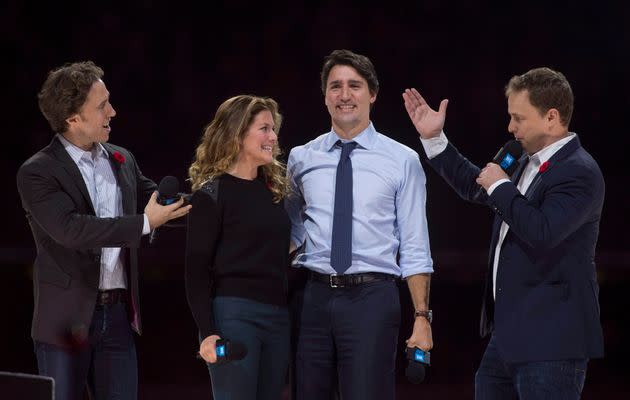 Craig (left) and Marc Kielburger introduce Prime Minister Justin Trudeau and his wife Sophie Gregoire-Trudeau as they appear at the WE Day celebrations in Ottawa on Nov. 10, 2015.