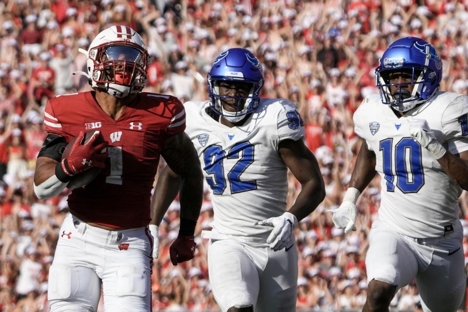 Wisconsin's Chez Mellusi (1) runs for a touchdown during the second half of an NCAA college football game against Buffalo Saturday, Sept. 2, 2023, in Madison, Wis. (AP Photo/Morry Gash)