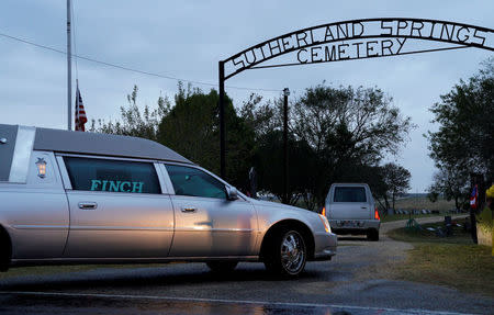 Two hearses arrive at the cemetery for the burial of Richard and Therese Rodriguez after the husband and wife were killed in the shooting at First Baptist Church of Sutherland Springs in Texas, U.S., November 11, 2017. REUTERS/Rick Wilking