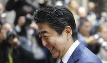 Japan's Prime Minister Shinzo Abe arrives for an EU-ASEM summit in Brussels, Friday, Oct. 19, 2018. EU leaders meet with their Asian counterparts Friday to discuss trade, among other issues. (AP Photo/Olivier Matthys)