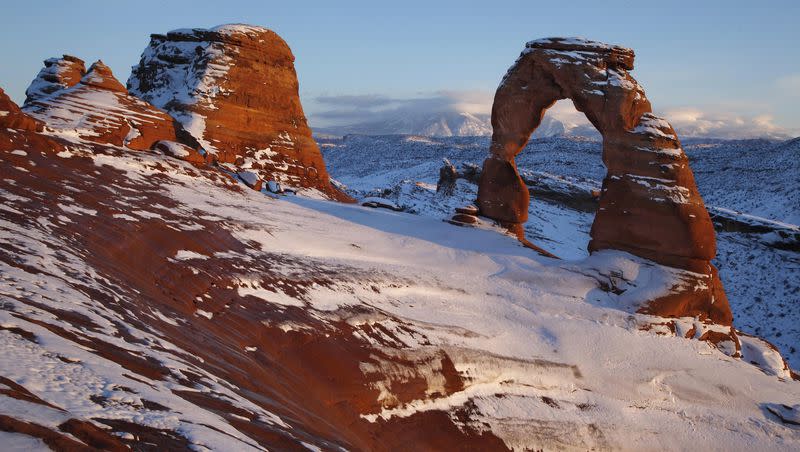 In this Dec. 31, 2010, file photo, snow covers delicate Arch at Arches National Park near Moab, Utah.