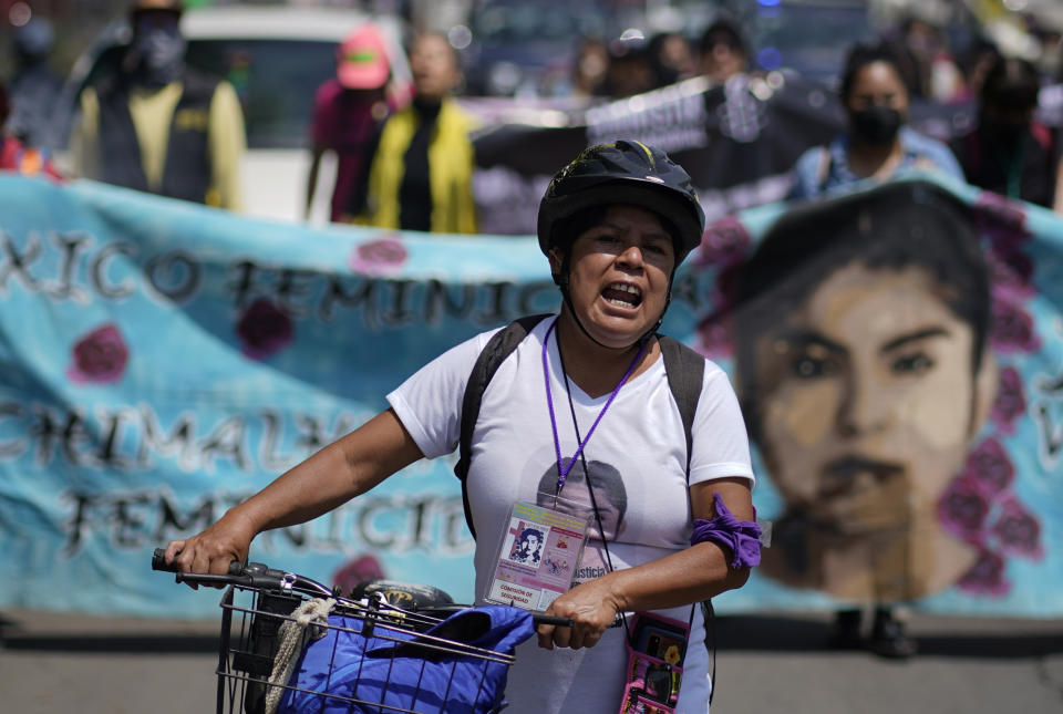 Lidia Florencio Guerrero shouts slogans during a march in memory of her daughter Diana Velázquez in Chimalhuacán, state of Mexico, Mexico, Saturday, July 2, 2022. The 24-year-old candy vendor was killed in 2017 when she left home early one morning to make a phone call. Her body was found later that day dumped in front of a warehouse. She’d been beaten, raped and strangled. (AP Photo/Eduardo Verdugo)