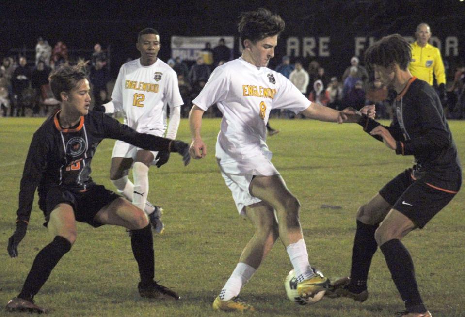 Mandarin midfielder Adis Mesic (10) and forward Antonio Mancinotti (11) challenge for possession with Englewood forward Jasmin Ljeskovica (8) during the Gateway Conference high school boys soccer championship.