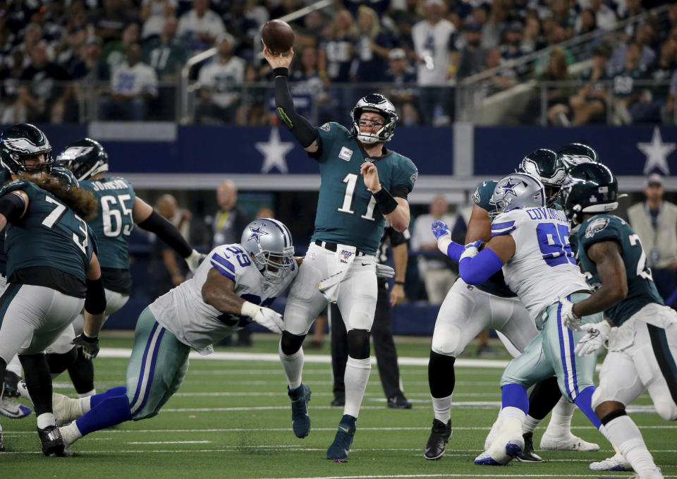 Dallas Cowboys defensive tackle Antwaun Woods (99) pressures Philadelphia Eagles' Carson Wentz (11) on a pass attempt in the first half of an NFL football game in Arlington, Texas, Sunday, Oct. 20, 2019. (AP Photo/Michael Ainsworth)