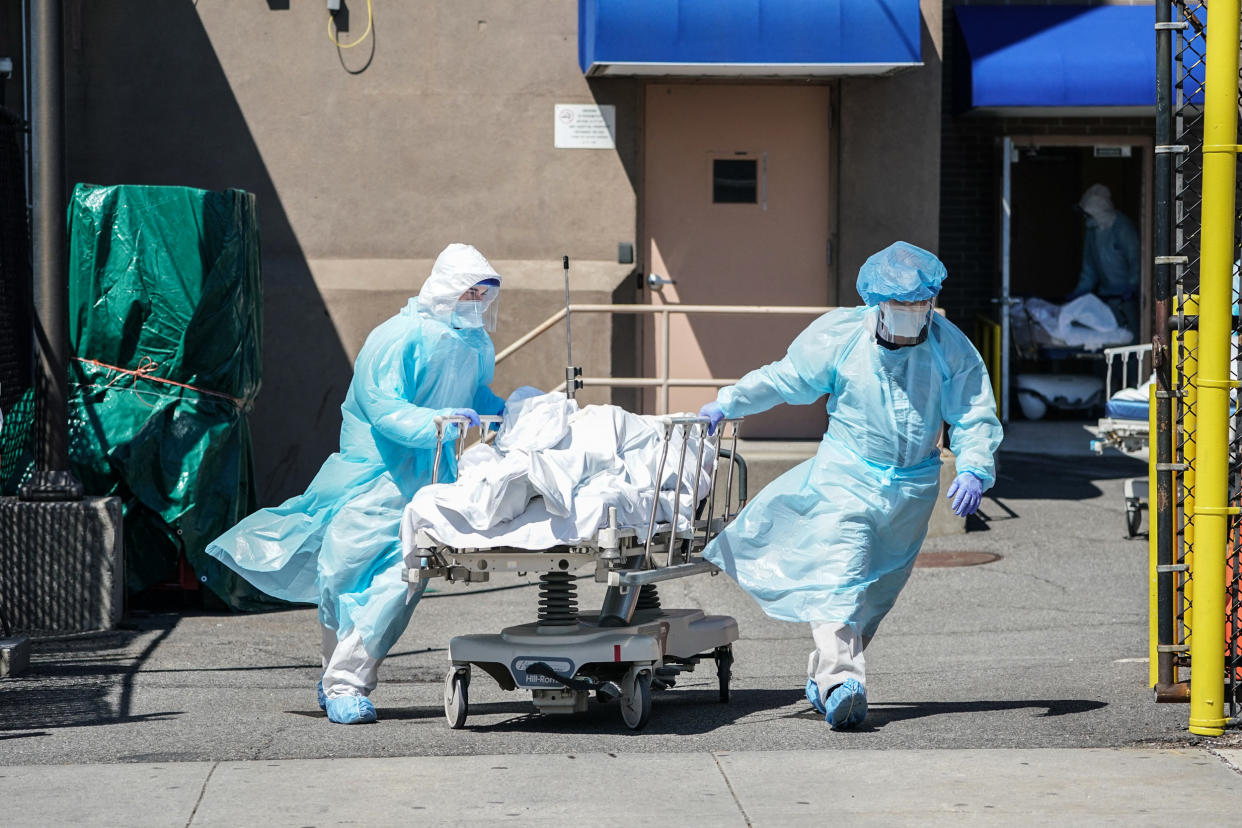 Bodies are moved to a refrigeration truck serving as a temporary morgue at Wyckoff Hospital in Brooklyn, N.Y., on April 6, 2020. (Bryan R. Smith / AFP via Getty Images file)