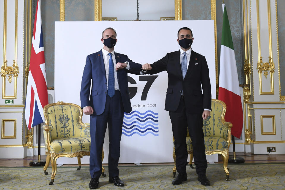 Britain's Foreign Secretary Dominic Raab, left, poses for a photo alongside Italian Minister of Foreign Affairs Luigi Di Maio, ahead of bi-lateral talks, during the G7 foreign ministers' meeting, in London, Tuesday May 4, 2021. Foreign ministers from the Group of Seven wealthy industrialized nations gathered in London to grapple with threats to health, prosperity and democracy. It is their first face-to-face meeting in more than two years. (Stefan Rousseau/Pool via AP)