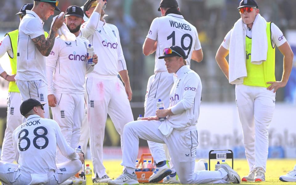 England players during a drinks break on day one