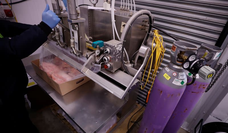 A worker uses Carbon Dioxide as part of the packaging process at the Soanes Poultry factory near Driffield